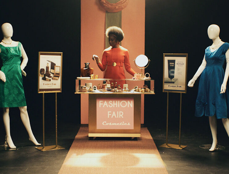 Documentary still image of woman at a fashion fair